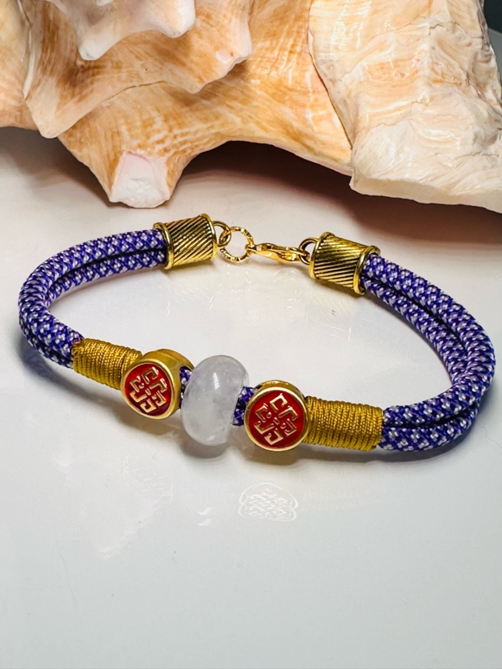 Handcrafted Purple Cord Bracelet with Gold Accents and Selenite Bead